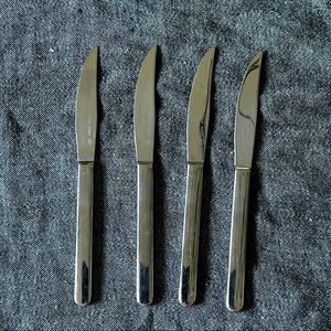 Set of (4) WUSTHOF stainless steel steak knives .